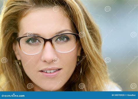 Portrait Of Mature Fashionable Woman Wearing Eyeglasses Stock Photo