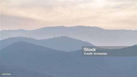 Silhouettes Of Mountains In The Sunset Haze Stock Photo Download