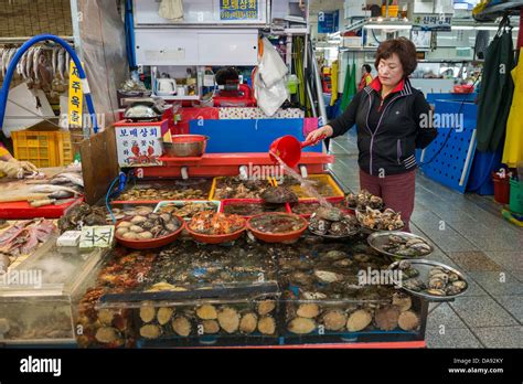 Seafood Vendor In Jagalchi Fish Market Specializing In Abalone Busan