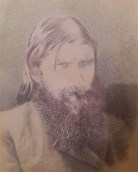 An Old Photo Of A Man With Long Hair And Beard