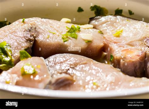 Marinated Swordfish In A Bowl With Lemon Oil Garlic Parsley Stock