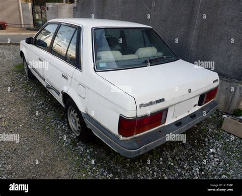 Abandoned Mazda Familia Sedan XE (BF) rear Stock Photo - Alamy