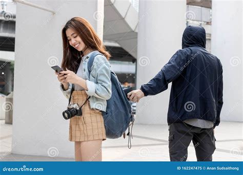 Selective Focus On Hands Of Pickpocket Thief Stealing Wallet From