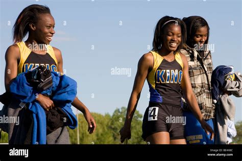 Members of the Rufus King High School relay team are all smiles after ...