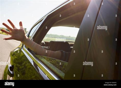 Boys Hand Outside Moving Car Window Stock Photo Alamy