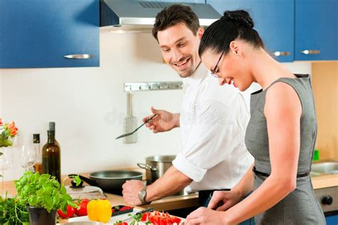 Couple Cooking Together In Kitchen Stock Image Image Of Evening