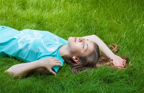 Pretty Teen Girl Lying On The Grass Laughter Joy Positive Emotions