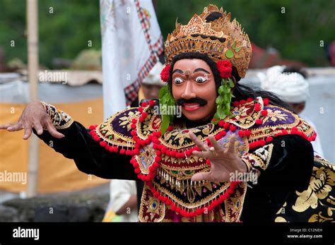 A masked topeng performer at a temple festival in Padang Bai, Bali ...