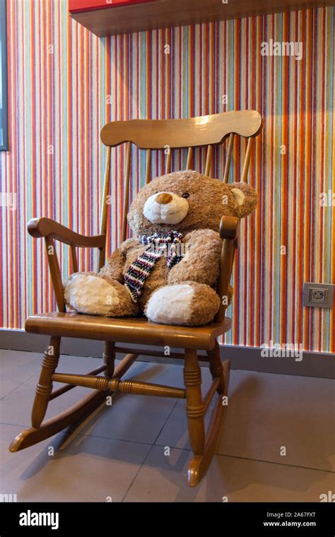 Teddy Bear Sitting In A Rocking Chair Stock Photo Alamy