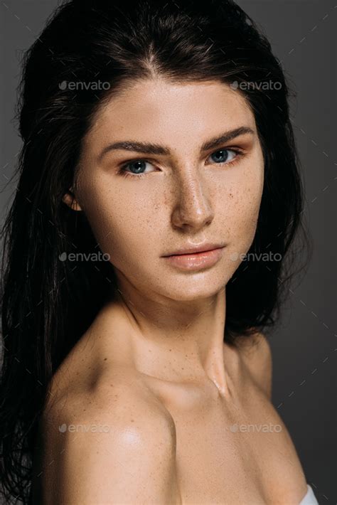 Portrait Of Beautiful Naked Woman With Freckles On Face Isolated On