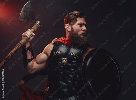 Bearded And Muscular Rome Warrior In Black Armor And Red Cloak Posing