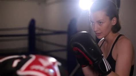 Two Female Boxers Sparring In The Ring Girls Practice Punches In