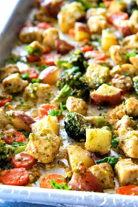 Easy Sheet Pan Parmesan Pesto Chicken With Potatoes Broccoli And Carrots