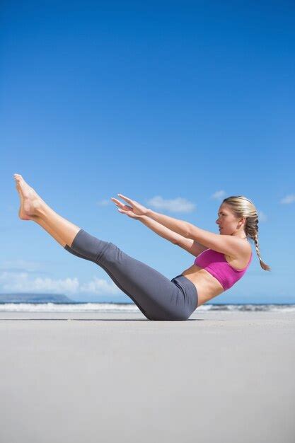 Premium Photo Focused Fit Blonde Doing Yoga On The Beach