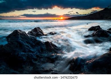 Sunset Over Rocks Sharrow Point Whitsand Foto Stock 256360060