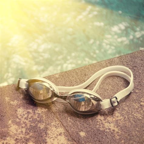 Premium Photo | Swimming sport goggles on the poolside