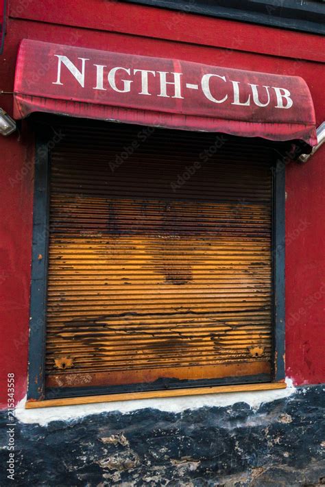 Closed window of closed or abandoned night club in a shabby house Stock Photo | Adobe Stock