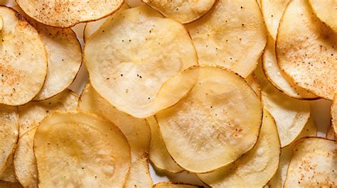 Detailed View Of Potato Chips Snack With Mouthwatering Seasoning