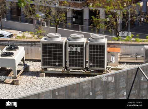 Industrial Air Conditioner Units On A Rooftop Of A Building Hvac