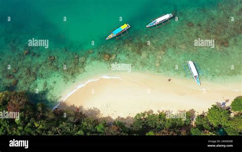 Tropical beach and turquoise water of the lagoon with tourists and ...