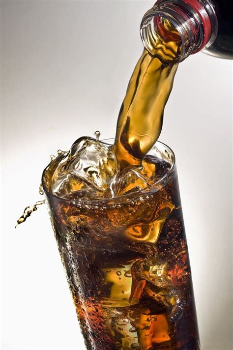 Pouring a Glass of Coca-cola with Ice Cubes Stock Image - Image of ...