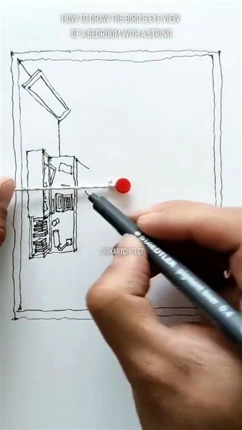 Someone Is Drawing A House On Paper With A Marker