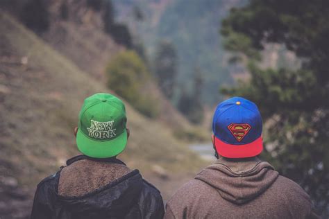 Hd Wallpaper Shallow Focus Photography Of Two Men Wearing Caps Adult