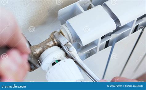 Plumber S Hands Install A Radiator With A Two Wrench Man Installing