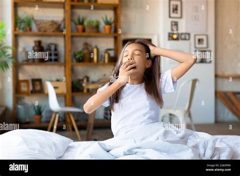 Morning A Ten Year Old Girl Woke Up Stretching And Yawning Stock