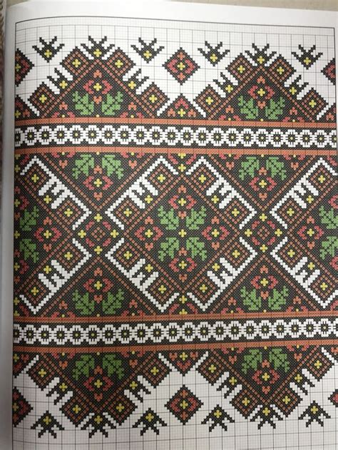 an open book with cross stitch designs on it