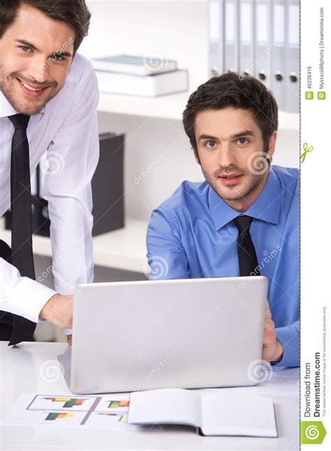 Two Businessmen Having Discussion In Office Stock Photo Image Of