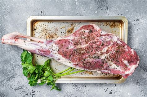 Marinated Whole Mutton Leg Raw Lamb Meat With Thyme Spices And Olive