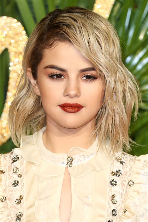 Selena Gomez Wavy Platinum Blonde Bob Dark Roots Shaggy Bob Hairstyle