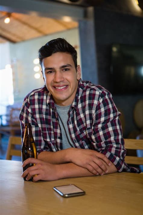 Portrait Of Smiling Man Holding Beer Bottle Stock Image Image Of