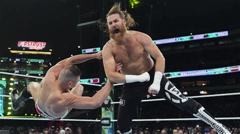 Why Booker T Says WWE S Sami Zayn Was The Right Person To Defeat