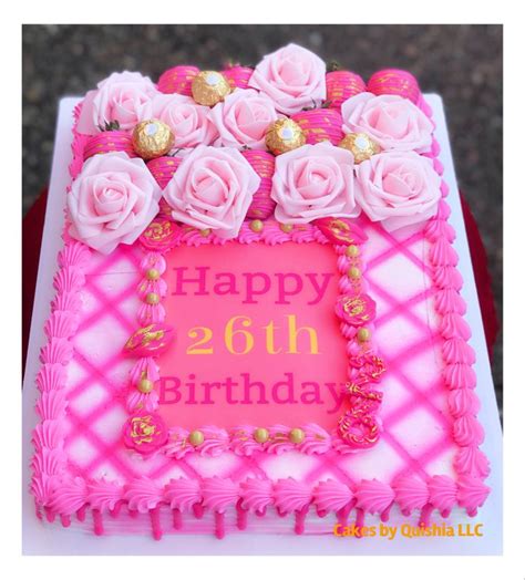 A Birthday Cake With Pink Frosting And Roses On It