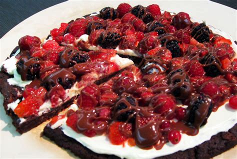 Toffee Brownie Dessert Pizza With Vanilla Cream And Berries Topped With Chocolate Caramel Ga