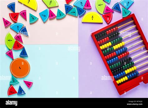 Colorful Math Fractions And Wooden Abacus On The Pink Blue Violet