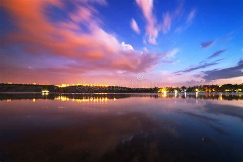 Beautiful Night Sky At The River With Stars And Clouds Stock Photo