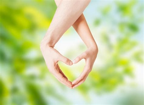 Premium Photo Close Up Of Couple Hands Showing Heart Gesture