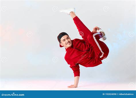 Asian Personal Break Dancer Trainer Doing Handstand On White Background