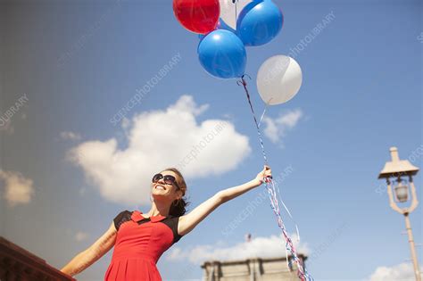 Woman With Bunch Of Balloons Stock Image F013 6297 Science Photo