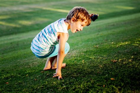 Happy Boy Playing With Ball And Toys On Green Grass Stock Image Image