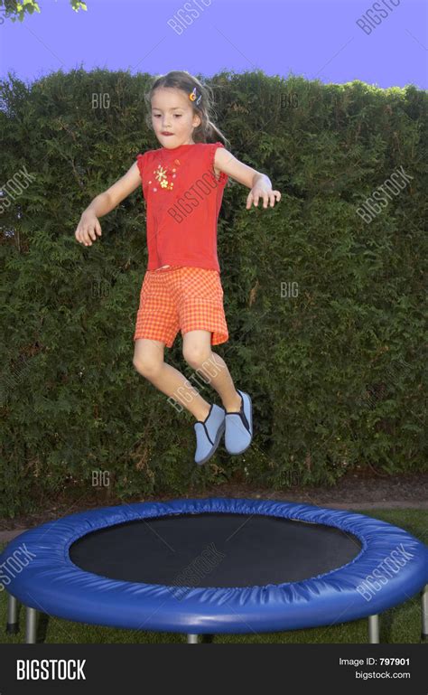 Young Girl Jumping On Trampoline Image And Photo Bigstock