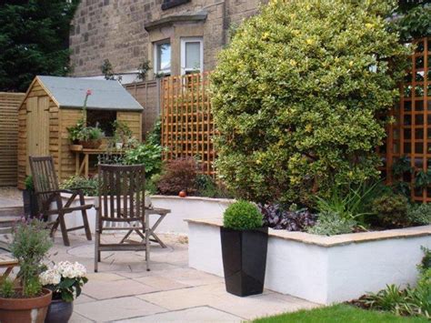 White Rendered Walls And Sandstone Paving And Coping Patio Garden