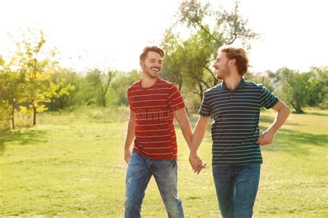 Happy Gay Couple Walking In Countryside Stock Photo Image Of Outdoors Homosexual