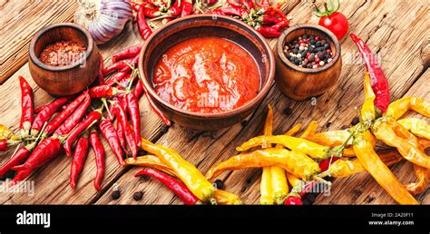 spicy hot chili sauce   chilli pepper stock photo alamy