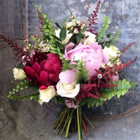 A stunning bouquet of peonies, wax flower, astilbe, spray roses and ...