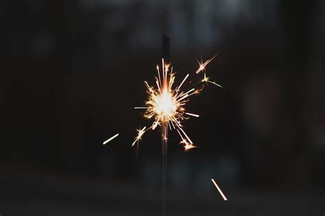 Premium Photo | Photography sparkler closeup on a dark background ...