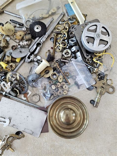 Lot Of Vintage Clock Parts Movements Misc Bolts Gears Key Brass